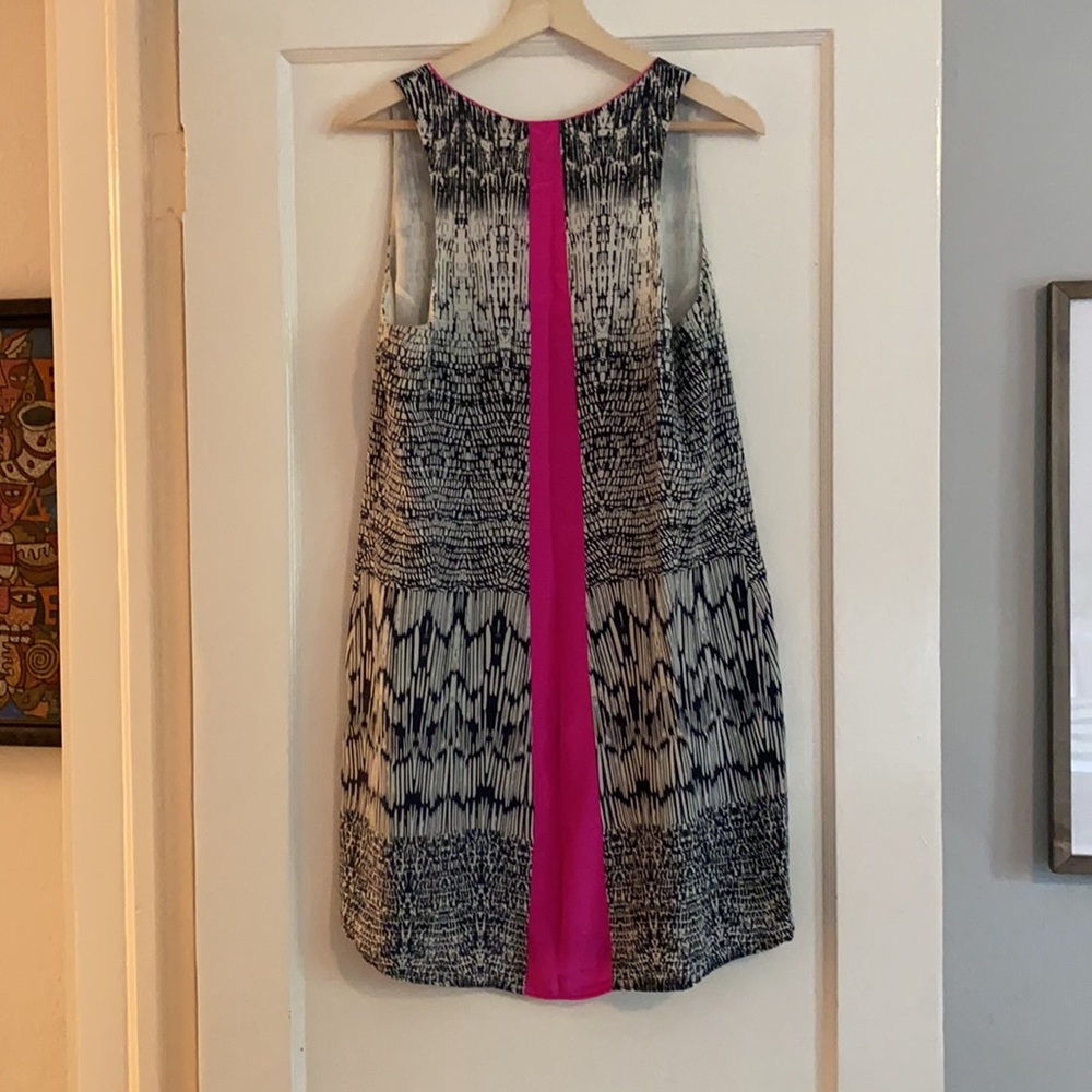 Fun navy/white patterned dress with bold pink stripe in back.